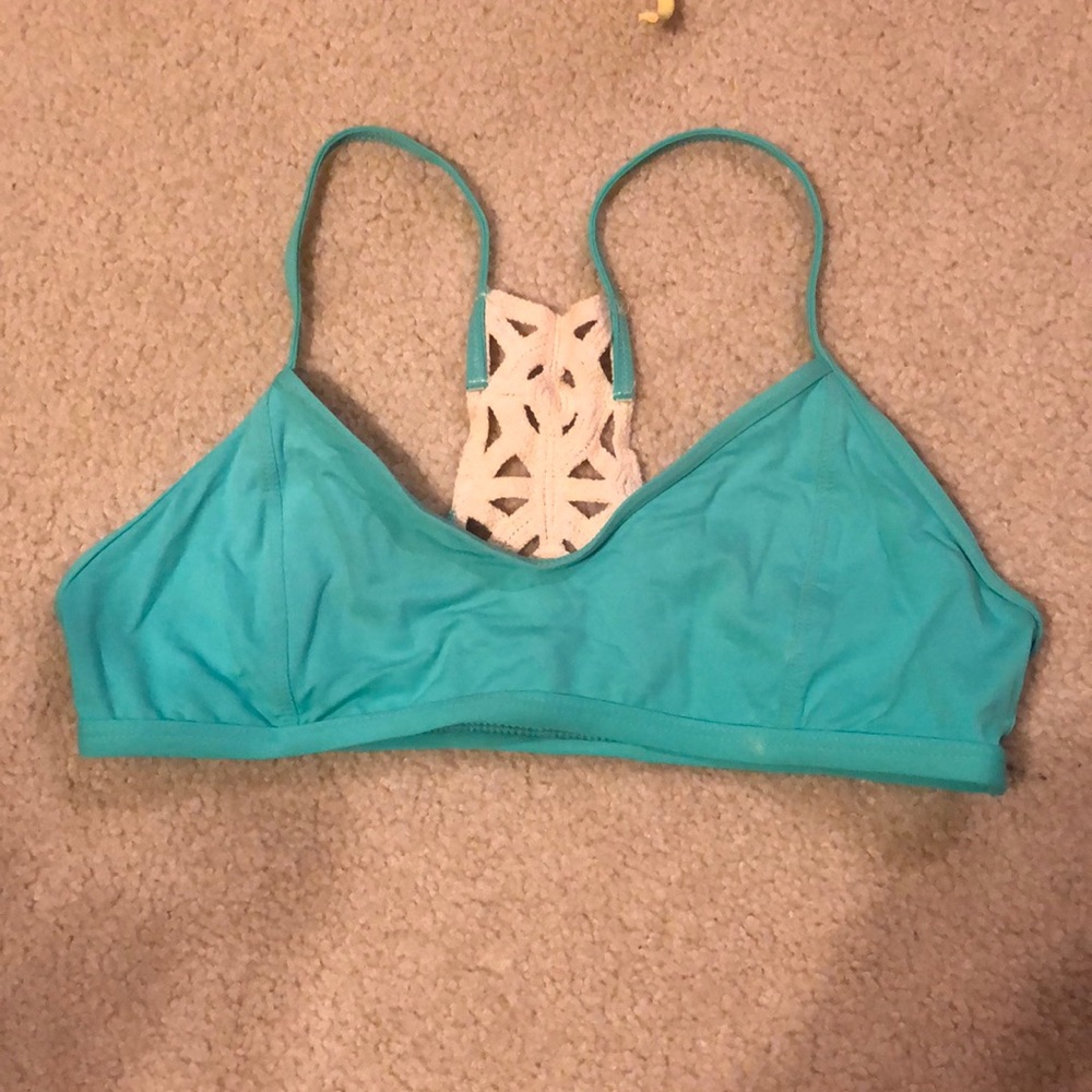 L Space teal bikini top with crocheted detail on razorback
